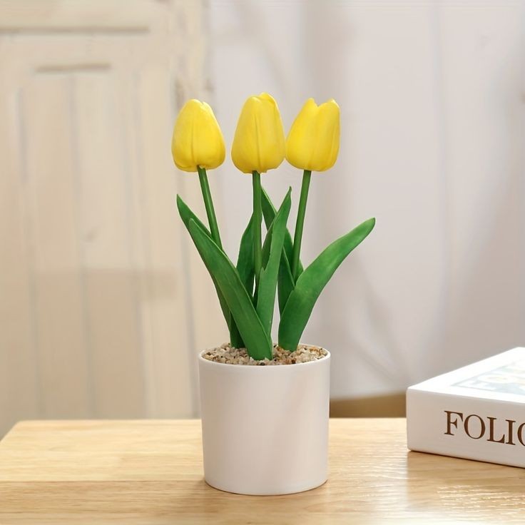 Golden tulip flower with vase
